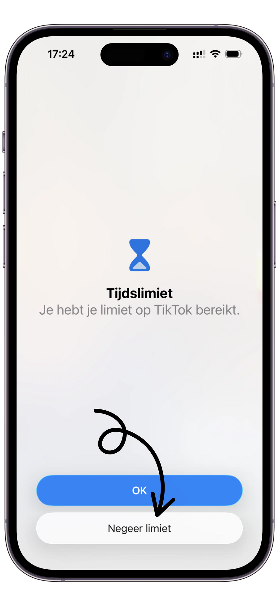 Een telefoon met de melding dat de tijdslimiet voor TikTok is bereikt, met een knop om de limiet te negeren